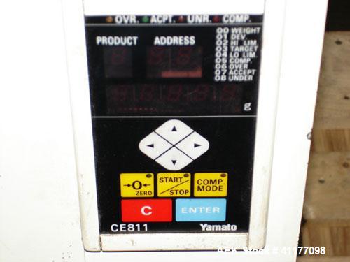 Used Yamato CA15L-00 Checkweigher. Weight range from 10g to 1500g with accuracy of +/- 1 gram. Last weighing cartons of ice cream cones. Dimensions: 31" L x R, 18" wide x 37" high. Belt width is 9".