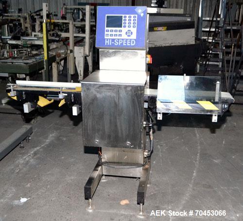 Used Garvens Model E2 Three Belt Checkweigher capable of speeds up to 200 containers per minute. Has a maximum weight range up to 600 grams. Has an air reject. 1/60/110V. Built 2004.