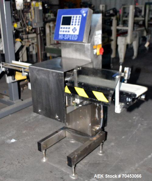 Used Garvens Model E2 Three Belt Checkweigher capable of speeds up to 200 containers per minute. Has a maximum weight range up to 600 grams. Has an air reject. 1/60/110V. Built 2004.