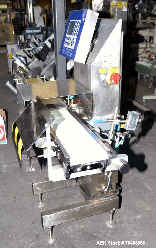 Used Garvens Model E2 Three Belt Checkweigher capable of speeds up to 200 containers per minute. Has a maximum weight range up to 600 grams. Has an air reject. 1/60/110V. Built 2004.