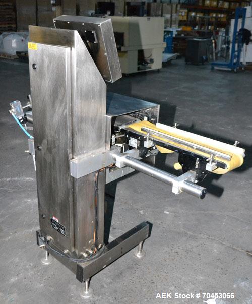Used Garvens Model E2 Three Belt Checkweigher capable of speeds up to 200 containers per minute. Has a maximum weight range up to 600 grams. Has an air reject. 1/60/110V. Built 2004.