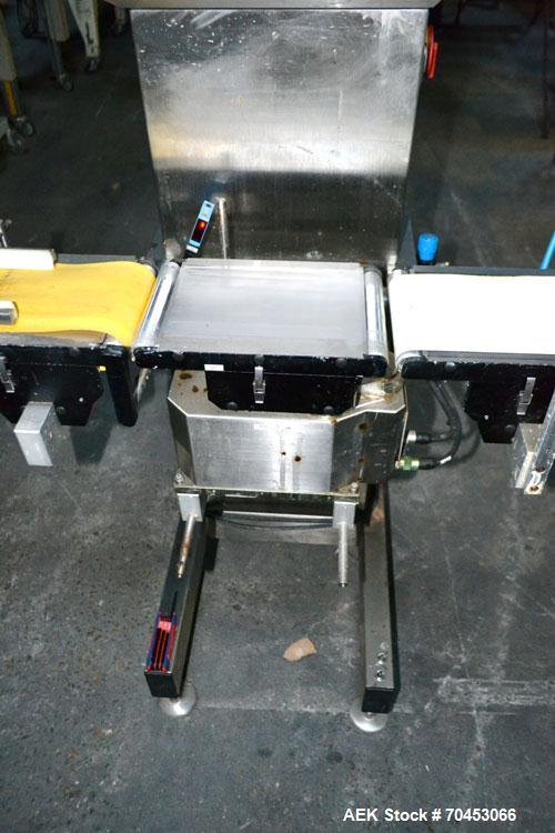 Used Garvens Model E2 Three Belt Checkweigher capable of speeds up to 200 containers per minute. Has a maximum weight range up to 600 grams. Has an air reject. 1/60/110V. Built 2004.