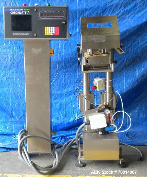Used Hi Speed Mettler Toledo Container Checkweigher, Model SST1100SS-CM. Stainless steel side belt load cell mechanism with a weight range up to 50 pounds. Capable of speeds up to 250 packages per mi...