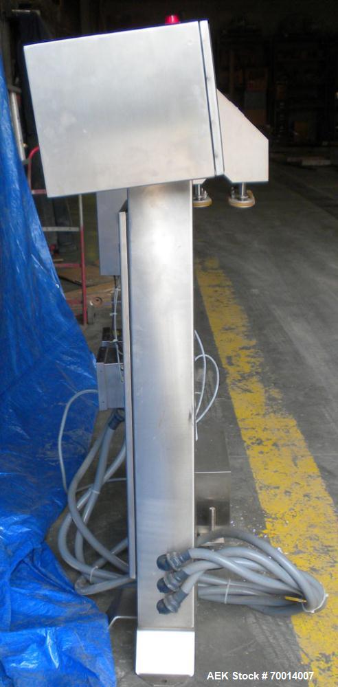 Used Hi Speed Mettler Toledo Container Checkweigher, Model SST1100SS-CM. Stainless steel side belt load cell mechanism with a weight range up to 50 pounds. Capable of speeds up to 250 packages per mi...