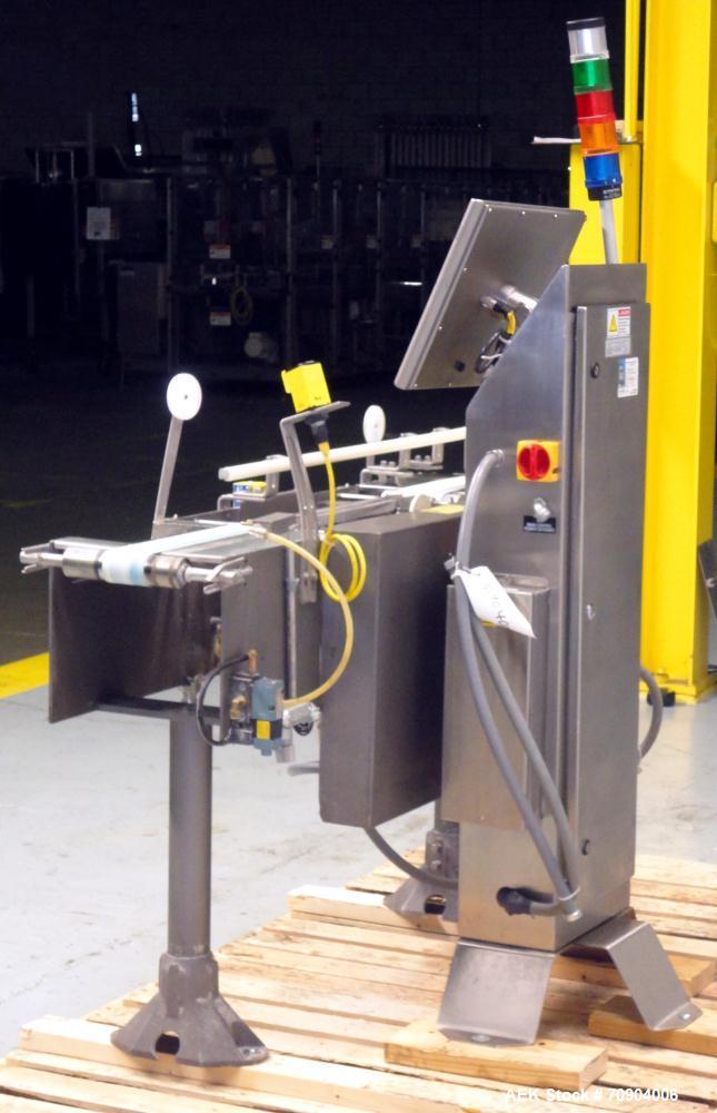 Used Mettler Toldeo XS Hi Speed Chain Checkweigher, Model CM9400-CM. Has the capacity to weigh up to 50 lbs., with a weigh pan length of 13". Currently set up to run 140 PPM, for carton size of 5.38"...