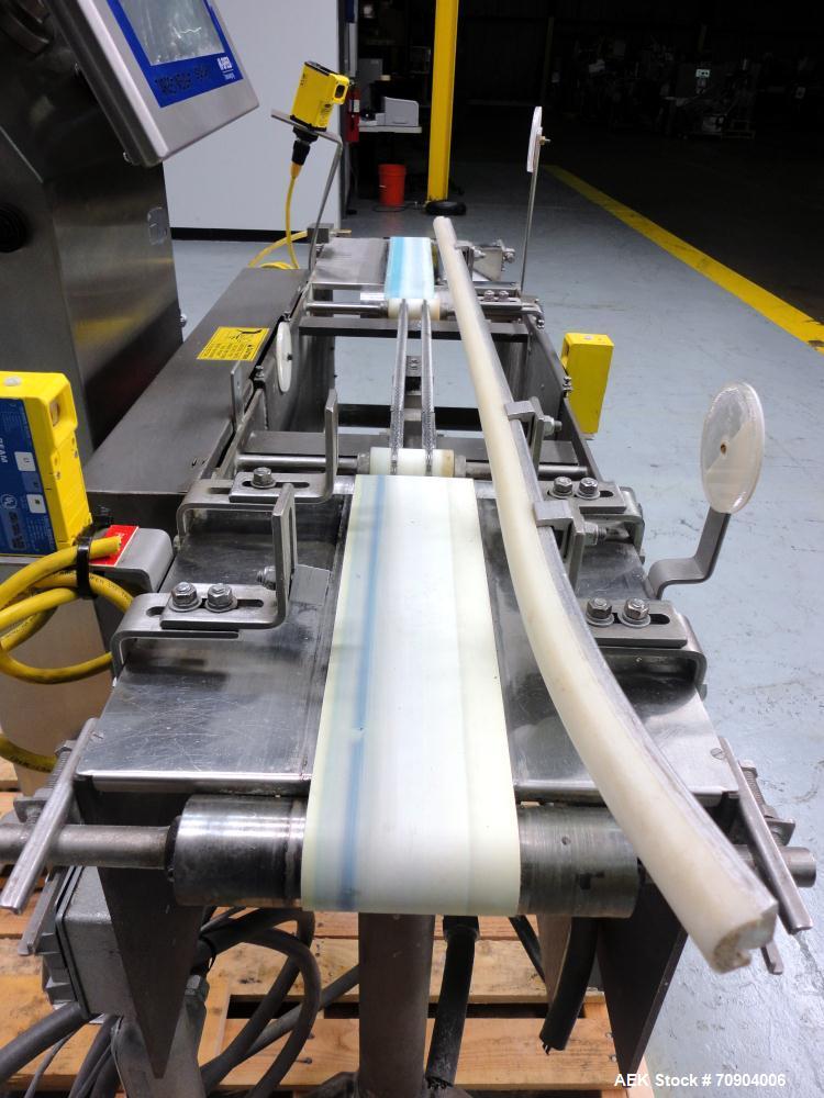 Used Mettler Toldeo XS Hi Speed Chain Checkweigher, Model CM9400-CM. Has the capacity to weigh up to 50 lbs., with a weigh pan length of 13". Currently set up to run 140 PPM, for carton size of 5.38"...