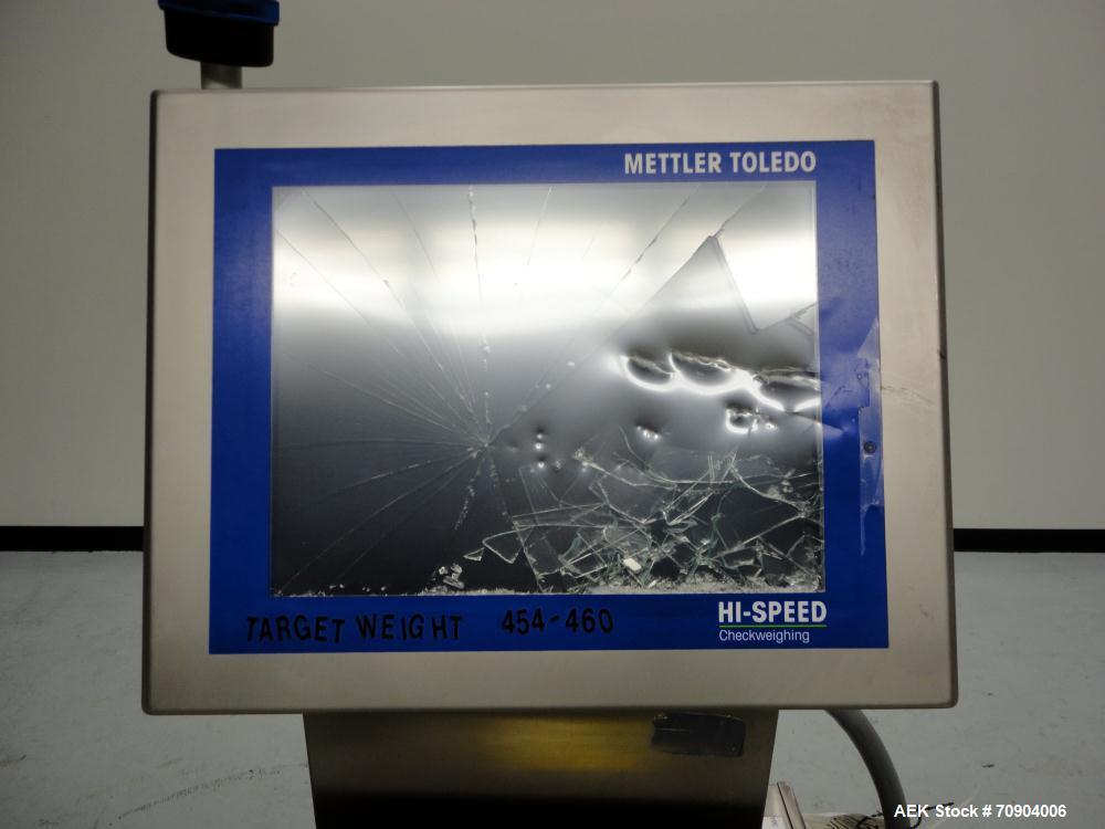 Used Mettler Toldeo XS Hi Speed Chain Checkweigher, Model CM9400-CM. Has the capacity to weigh up to 50 lbs., with a weigh pan length of 13". Currently set up to run 140 PPM, for carton size of 5.38"...