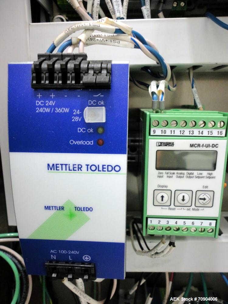 Used Mettler Toldeo XS Hi Speed Chain Checkweigher, Model CM9400-CM. Has the capacity to weigh up to 50 lbs., with a weigh pan length of 13". Currently set up to run 140 PPM, for carton size of 5.38"...