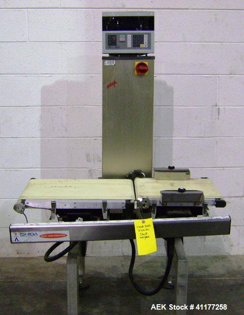 Used Ishida Checkweigher, Model DACS-W-050-SB/PB-I. Capable of speeds up to 130 PPM. Has a weight range from 50 to 5500 g. Has belt infeed and reject mechanism. Weighing accuracy: +/- 2.0 gram. Produ...