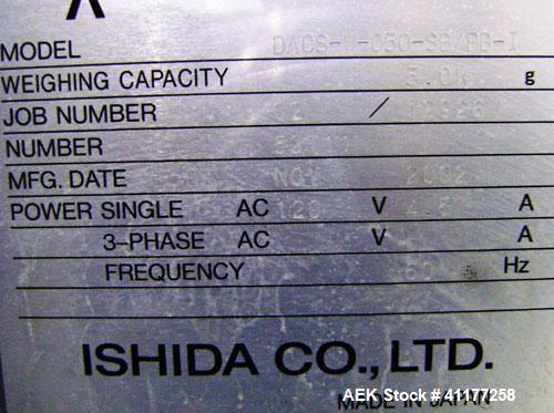 Used Ishida Checkweigher, Model DACS-W-050-SB/PB-I. Capable of speeds up to 130 PPM. Has a weight range from 50 to 5500 g. Has belt infeed and reject mechanism. Weighing accuracy: +/- 2.0 gram. Produ...