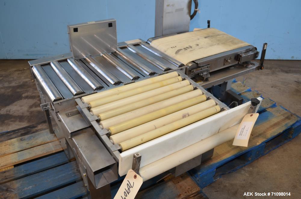 Used Ishida Model DACSW180SBWPN 18 Kg Maximum Capacity Full Case, Shipper sized Checkweigher with Reject Conveyor Section. Weighing range of 180 g - 18 kg. Maximum weighing speed 84 WPM. Weighing acc...