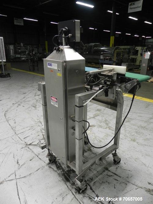 Used Lock Model Weigh Chek CK2500 Belt Checkweigher. Machine is capable of speeds up to 300 cases per minute (dependent on case size). Has a package weight range of 10 of 2500 g and a weight cell cap...