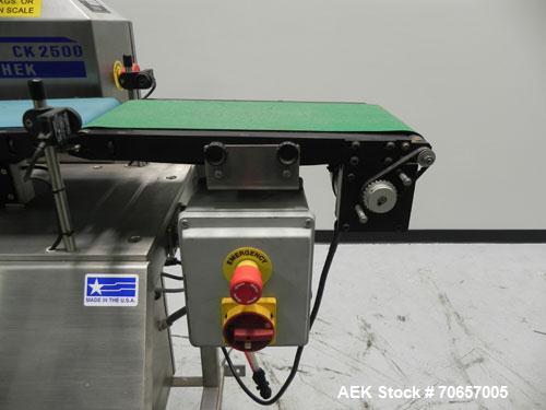 Used Lock Model Weigh Chek CK2500 Belt Checkweigher. Machine is capable of speeds up to 300 cases per minute (dependent on case size). Has a package weight range of 10 of 2500 g and a weight cell cap...