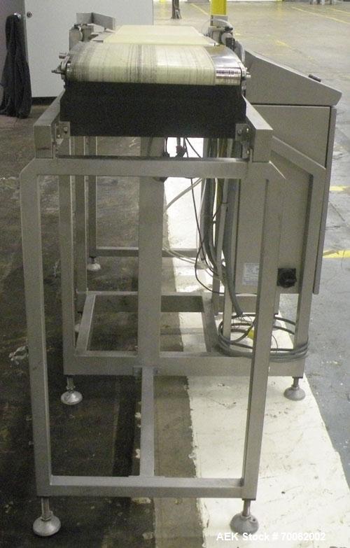 Used Loma Belt Checkweigher, Series 7000. Capable of speeds up to, weight range to 20 kg. Conveyor speed 57.8 meter per minute. 12/1/2" wide x 26" long infeed belt, 13" wide x 19" long weigh section ...