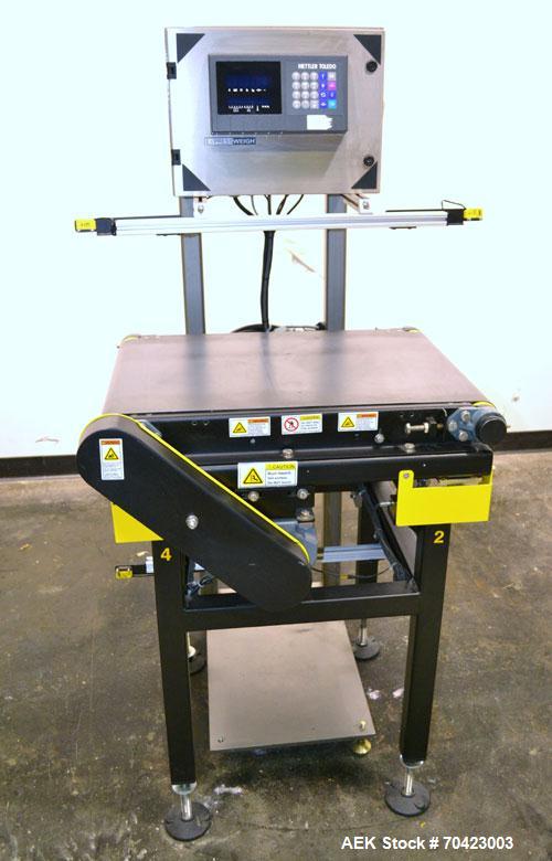 Used Mettler Toledo Model 9482 ExpressWeigh Checkweigher. Capable of 15 to 100 cartons per minute. Consisting of:  (1) Model 9482 Expressweigh controller, (1) Jagxtreme controller, (1) Model 9477 bel...