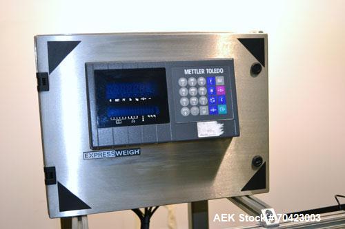 Used Mettler Toledo Model 9482 ExpressWeigh Checkweigher. Capable of 15 to 100 cartons per minute. Consisting of:  (1) Model 9482 Expressweigh controller, (1) Jagxtreme controller, (1) Model 9477 bel...