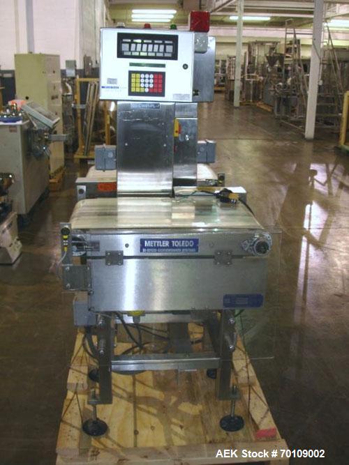Used Mettler Toledo Hi-Speed Checkweigher, Model CS34000WD-mm.; 18" wide x 27" long belt. Mounted on a stainless steel frame with a Micromate control panel.