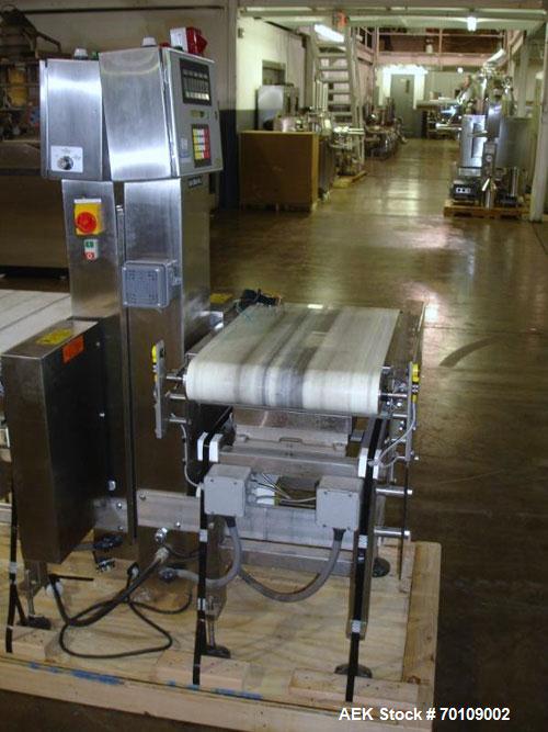 Used Mettler Toledo Hi-Speed Checkweigher, Model CS34000WD-mm.; 18" wide x 27" long belt. Mounted on a stainless steel frame with a Micromate control panel.