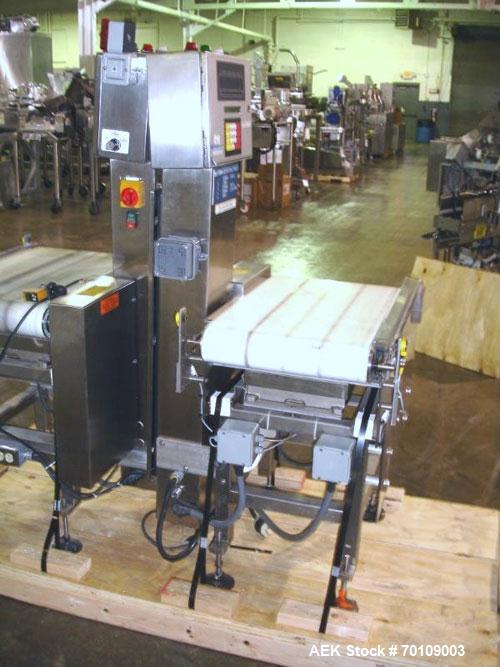 Used Mettler Toledo Hi-Speed Checkweigher, Model CS34000WD-mm.; 18" wide x 27" long belt. Mounted on a stainless steel frame with a Micromate control panel.