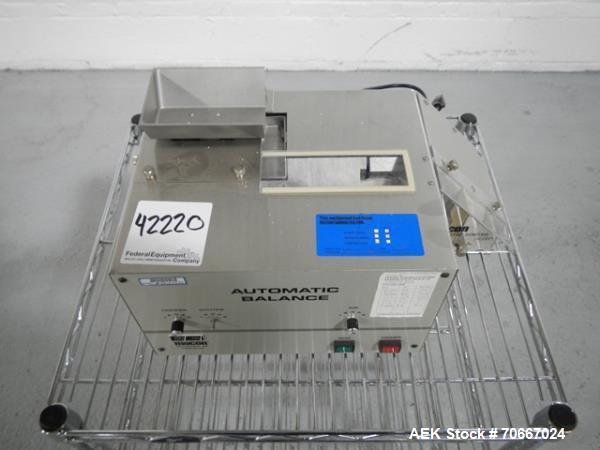 Used Mocon Automatic Balance Checkweigher with Mocon automatic sorter, model AB-Plus Master, speeds from 20-45 units/minute, 1-0.1 mg readability, serial #0499AX065.