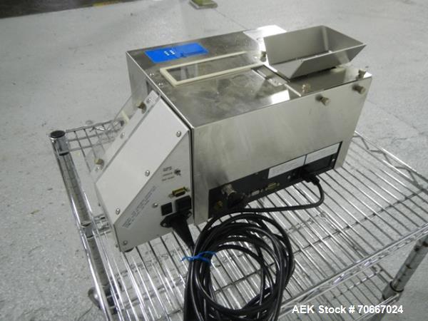 Used Mocon Automatic Balance Checkweigher with Mocon automatic sorter, model AB-Plus Master, speeds from 20-45 units/minute, 1-0.1 mg readability, serial #0499AX065.