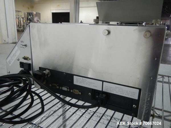 Used Mocon Automatic Balance Checkweigher with Mocon automatic sorter, model AB-Plus Master, speeds from 20-45 units/minute, 1-0.1 mg readability, serial #0499AX065.