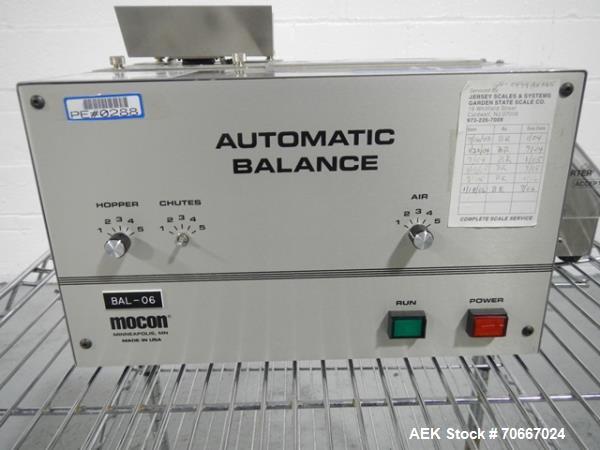 Used Mocon Automatic Balance Checkweigher with Mocon automatic sorter, model AB-Plus Master, speeds from 20-45 units/minute, 1-0.1 mg readability, serial #0499AX065.