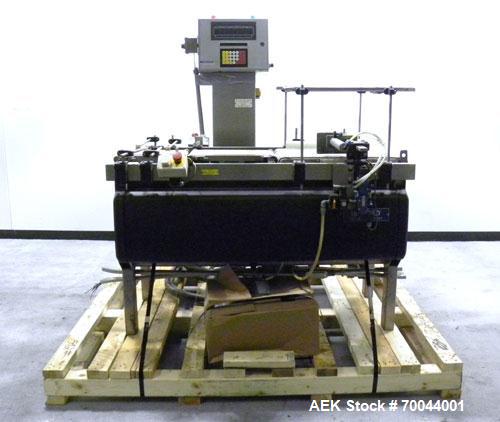 Used Mettler Toledo Hi-Speed Micromate Checkweigher, Model Beltway MM. 8" wide x 13" long infeed rubber belt, 8" wide x 17" long rubber weight belt, 16" wide x 24" long plastic discharge belt with ai...