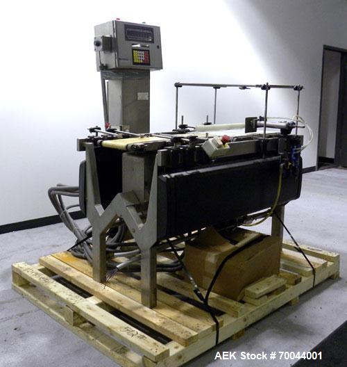 Used Mettler Toledo Hi-Speed Micromate Checkweigher, Model Beltway MM. 8" wide x 13" long infeed rubber belt, 8" wide x 17" long rubber weight belt, 16" wide x 24" long plastic discharge belt with ai...