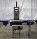 Used Alpha (All-Fill) Model CW-10 Checkweigher. Capable of speeds up to 250 packages per minute. Can handle package weights up to 9 lbs with dimensions up to 15