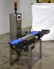 Used Alpha (All-Fill) Model CW-10 Checkweigher. Capable of speeds up to 250 packages per minute. Can handle package weights up to 9 lbs with dimensions up to 15