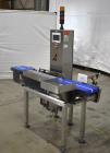 Used Alpha (All-Fill) Model CW-10 Checkweigher. Capable of speeds up to 250 packages per minute. Can handle package weights up to 9 lbs with dimensions up to 15
