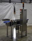 Used Alpha (All-Fill) Model CW-10 Checkweigher. Capable of speeds up to 250 packages per minute. Can handle package weights up to 9 lbs with dimensions up to 15