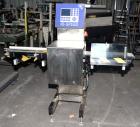 Used Garvens Model E2 Three Belt Checkweigher capable of speeds up to 200 containers per minute. Has a maximum weight range up to 600 grams. Has an air reject. 1/60/110V. Built 2004.