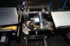Used Garvens Model E2 Three Belt Checkweigher capable of speeds up to 200 containers per minute. Has a maximum weight range up to 600 grams. Has an air reject. 1/60/110V. Built 2004.