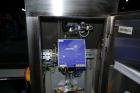 Used Garvens Model E2 Three Belt Checkweigher capable of speeds up to 200 containers per minute. Has a maximum weight range up to 600 grams. Has an air reject. 1/60/110V. Built 2004.