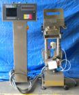 Used Hi Speed Mettler Toledo Container Checkweigher, Model SST1100SS-CM. Stainless steel side belt load cell mechanism with a weight range up to 50 pounds. Capable of speeds up to 250 packages per mi...