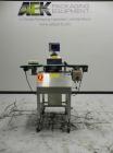 Used Lock Model Weigh Chek CK2500 Belt Checkweigher. Machine is capable of speeds up to 300 cases per minute (dependent on case size). Has a package weight range of 10 of 2500 g and a weight cell cap...