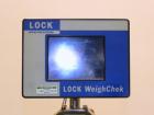 Used Lock Model Weigh Chek CK2500 Belt Checkweigher. Machine is capable of speeds up to 300 cases per minute (dependent on case size). Has a package weight range of 10 of 2500 g and a weight cell cap...