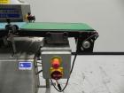 Used Lock Model Weigh Chek CK2500 Belt Checkweigher. Machine is capable of speeds up to 300 cases per minute (dependent on case size). Has a package weight range of 10 of 2500 g and a weight cell cap...