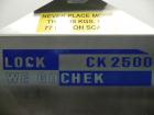 Used Lock Model Weigh Chek CK2500 Belt Checkweigher. Machine is capable of speeds up to 300 cases per minute (dependent on case size). Has a package weight range of 10 of 2500 g and a weight cell cap...