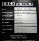Used Lock Model Weigh Chek CK2500 Belt Checkweigher. Machine is capable of speeds up to 300 cases per minute (dependent on case size). Has a package weight range of 10 of 2500 g and a weight cell cap...