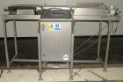 Used Loma Belt Checkweigher, Series 7000. Capable of speeds up to, weight range to 20 kg. Conveyor speed 57.8 meter per minute. 12/1/2