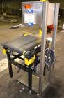 Used Mettler Toledo Model 9482 ExpressWeigh Checkweigher. Capable of 15 to 100 cartons per minute. Consisting of:  (1) Model 9482 Expressweigh controller, (1) Jagxtreme controller, (1) Model 9477 bel...