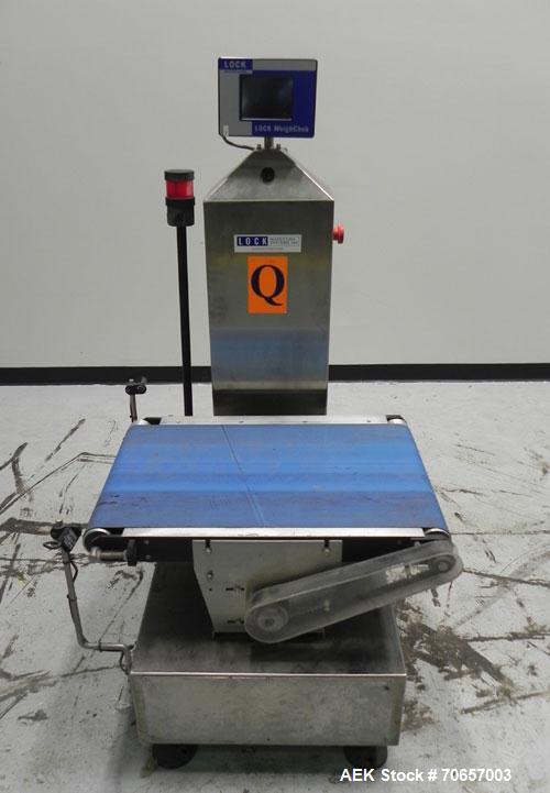 Used Lock Model WeighChek CK-50 Full Case Checkweigher. Machine has a maximum speed of up to 10 cases per minute (depending on case size). Has a weight range of 1,000 - 40,000 g with an accuracy rati...