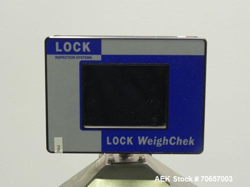 Used Lock Model WeighChek CK-50 Full Case Checkweigher. Machine has a maximum speed of up to 10 cases per minute (depending on case size). Has a weight range of 1,000 - 40,000 g with an accuracy rati...