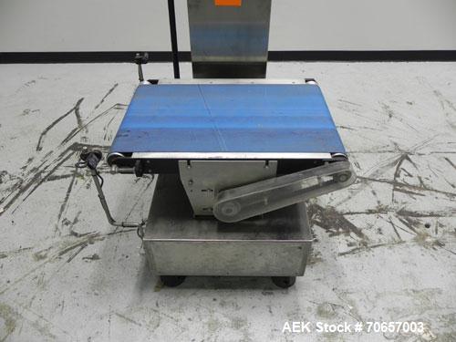 Used Lock Model WeighChek CK-50 Full Case Checkweigher. Machine has a maximum speed of up to 10 cases per minute (depending on case size). Has a weight range of 1,000 - 40,000 g with an accuracy rati...