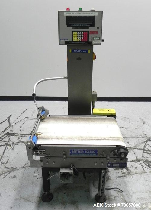 Used Mettler Toledo Hi-Speed Model CS 3400 GT-MM Full Case Check Weigher. Machine has a weight capacity of 10-15lbs. This unit is designed to handle cases, belt dimension 18" wide X 30" long.