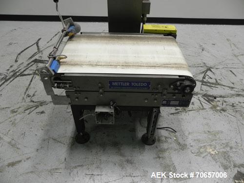 Used Mettler Toledo Hi-Speed Model CS 3400 GT-MM Full Case Check Weigher. Machine has a weight capacity of 10-15lbs. This unit is designed to handle cases, belt dimension 18" wide X 30" long.