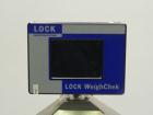 Used Lock Model WeighChek CK-50 Full Case Checkweigher. Machine has a maximum speed of up to 10 cases per minute (depending on case size). Has a weight range of 1,000 - 40,000 g with an accuracy rati...